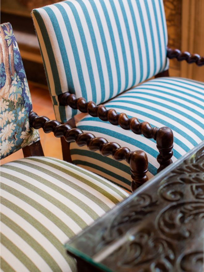 Detail of striped upholstery on armchairs