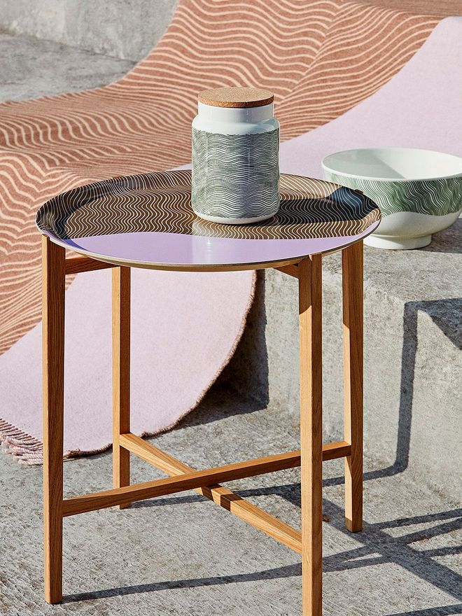 Products adorned with Marimekko's Gabriel Näkki print: a tray, a jar, a bowl, and a blanket.