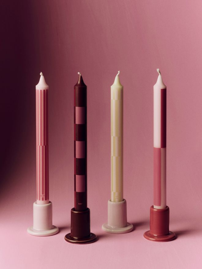 HAY's red-toned Pattern candles against a reddish background