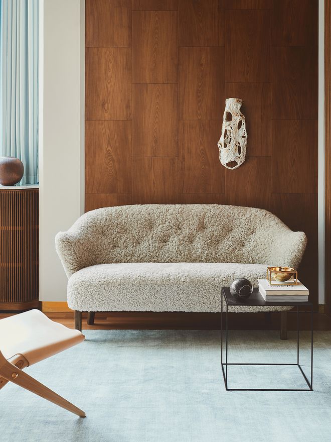 By Lassen's Ingeborg sofa with sheepskin upholstery placed in a livingroom.