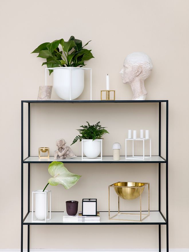 Pieces from By Lassen's Kubus collection displayed on a shelf.