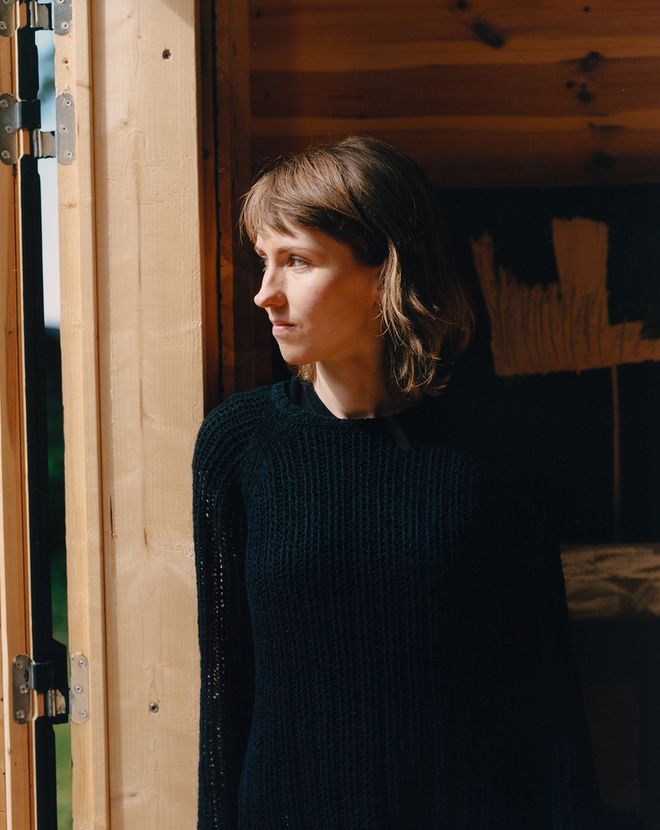 Portrait of Linn Henrichson looking out the door