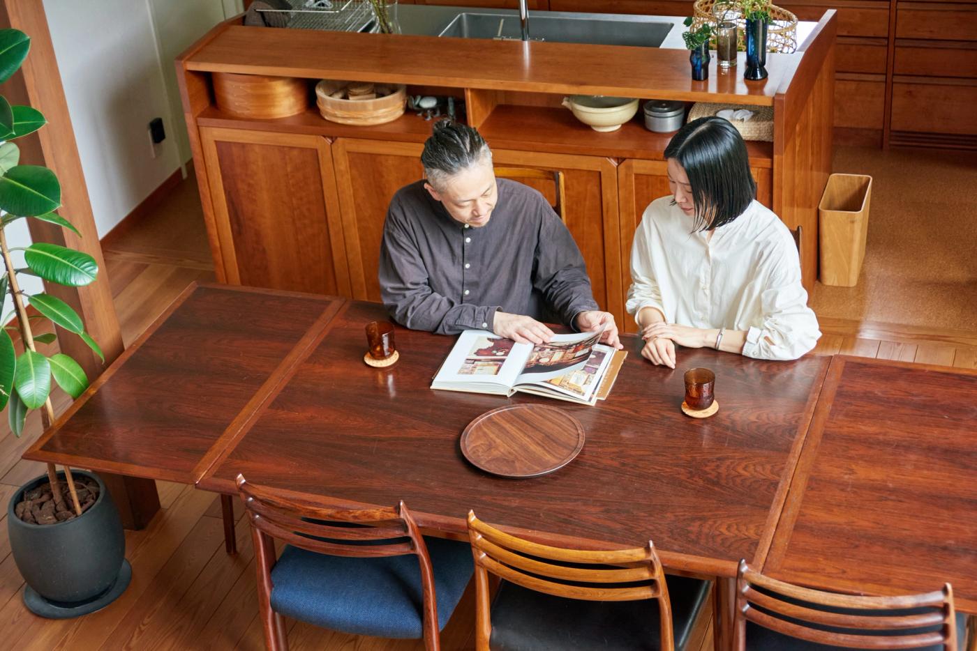 A couple sitting in a dining room 