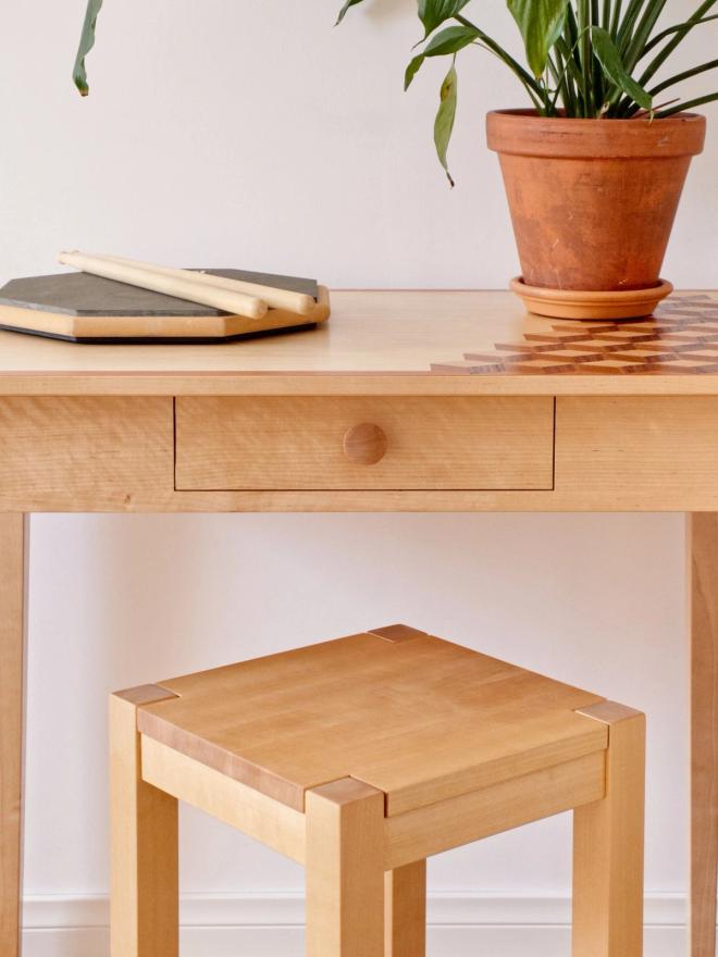 A carpenter-made stool and table with an intarsia surface