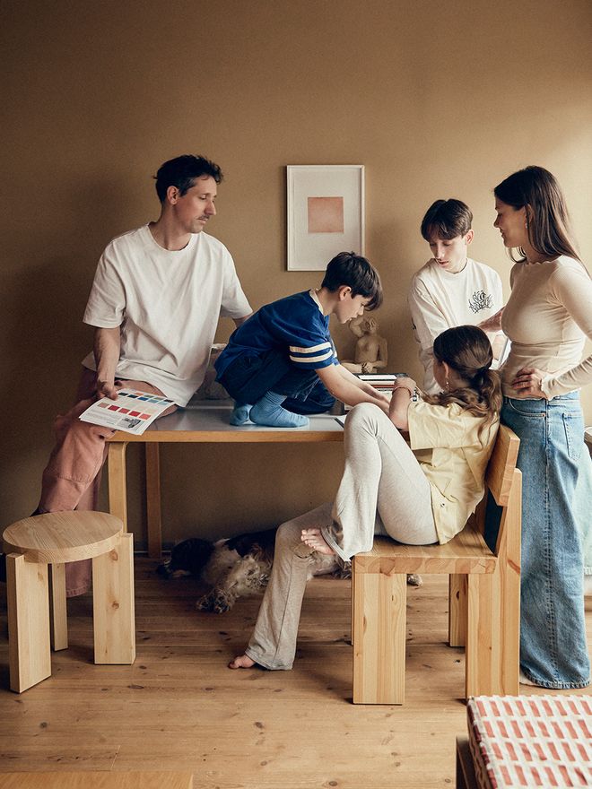 Ida Lauga with her husband and three children around a dining table