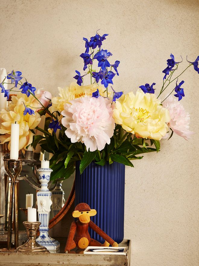 A wooden monkey, vase and candleholders at Johanna and Daniel Bruun's home