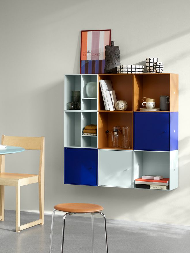 Montana's Mini modules in different colors, attached to a wall.