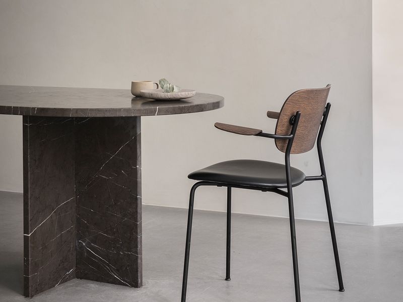 Furniture now: dark wood and round shapes