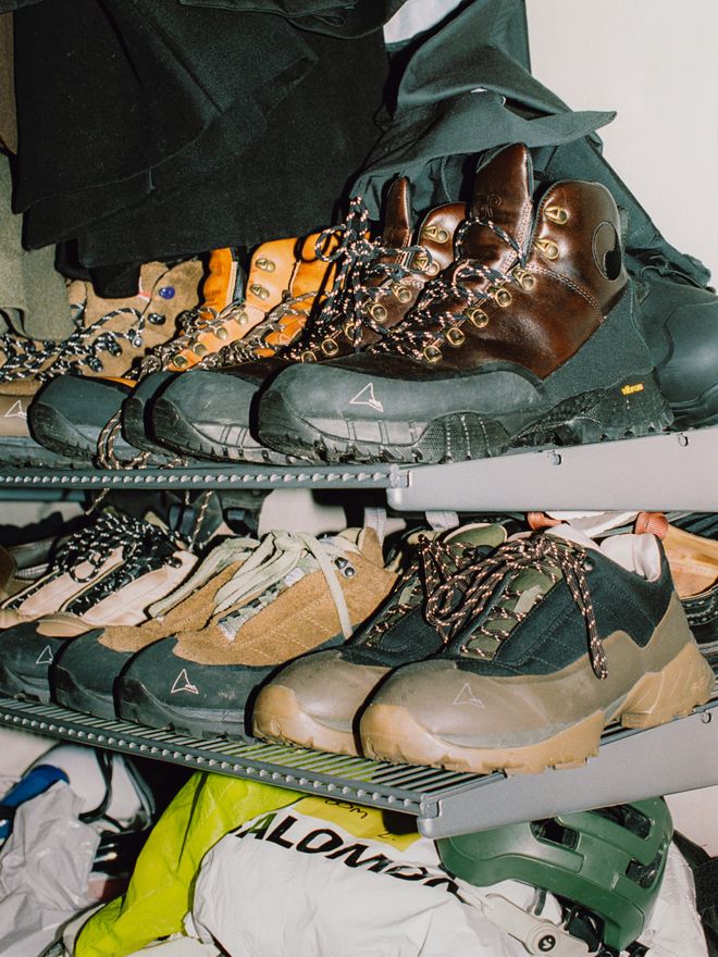Hiking and running shoes on a shelf