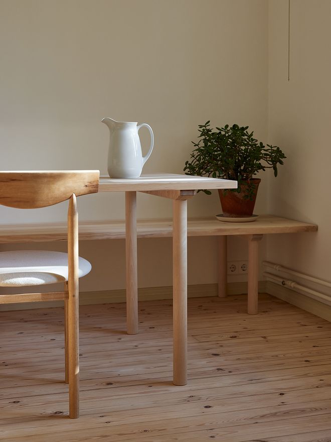 A detail image of a wooden kitchen table