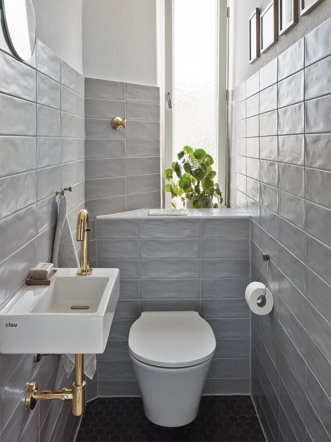 Guest toilet with a brass faucet