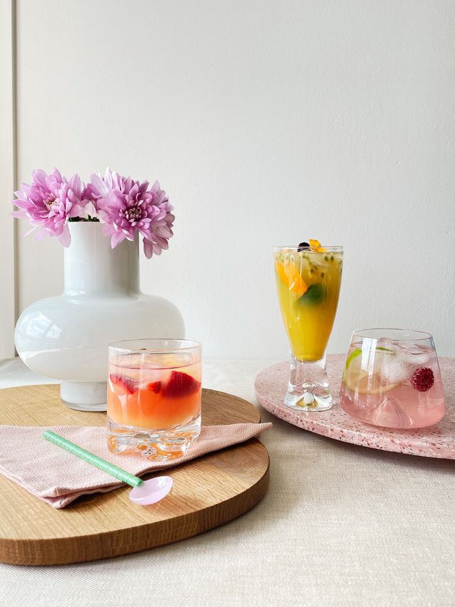 An image of Iittala's Gaissa glass, Tapio beer glass and Normann Copenhagen's Whisky glass in a table setting.