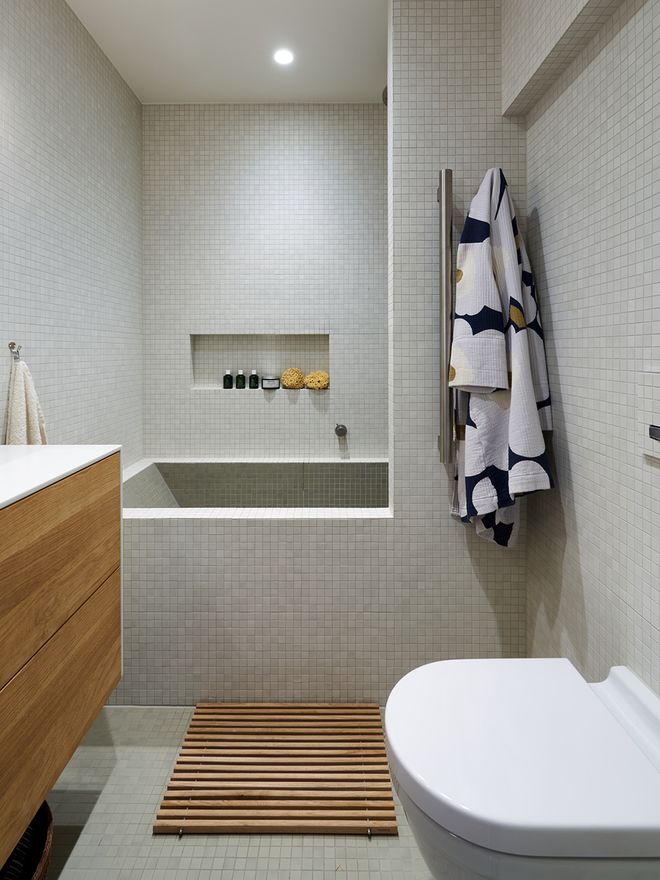 A renovated Scandinavian bathroom with oak details