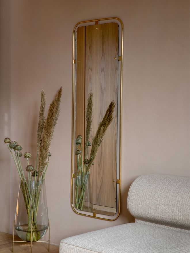 Menu's Nimbus mirror in living room decor.