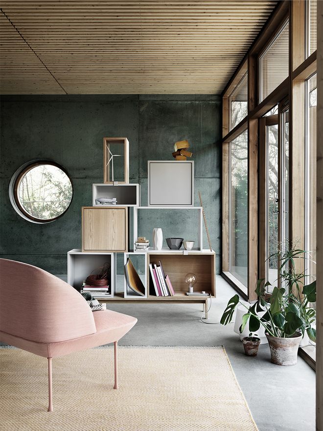 Muuto's Oslo lounge chair and Stacked shelving modules in living room decor.