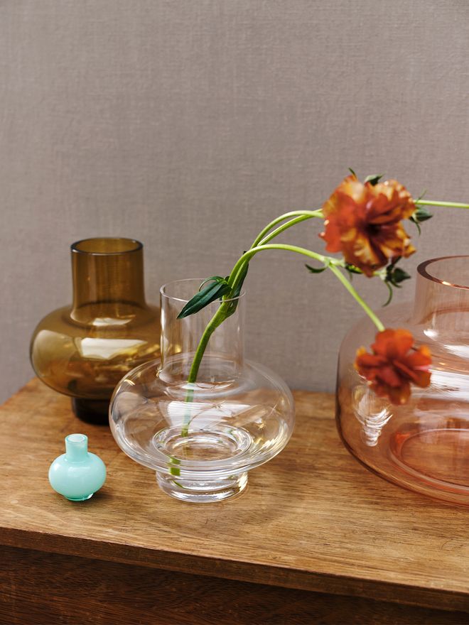 Marimekko's vases Umpu, Mini, and Urna placed on a table.