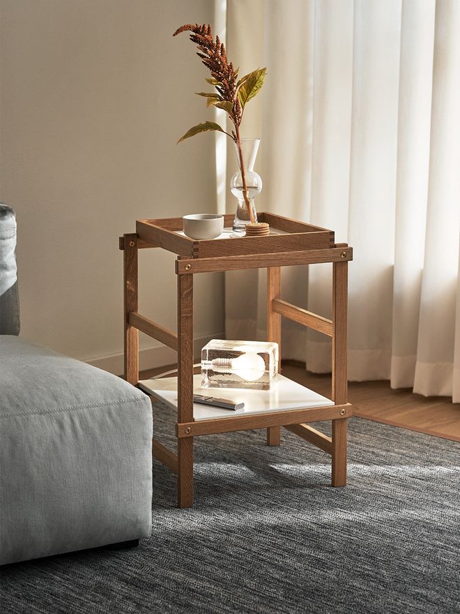 An image featuring Design House Stockholm's Block lamp as part of the living room decor.