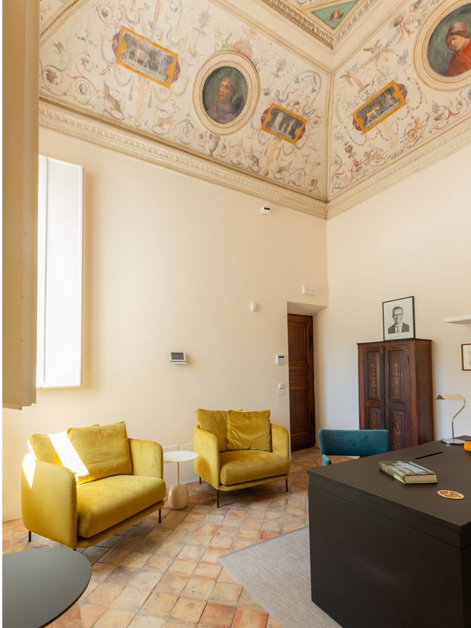 Yellow armchairs in an office room at Villa Lante