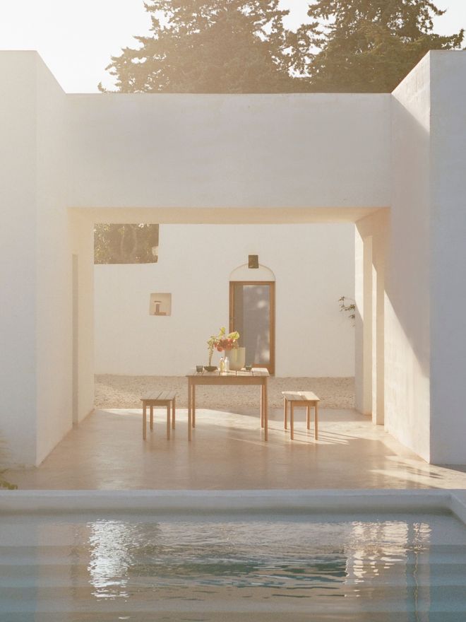 Assemble outdoor furniture on a sun-drenched terrace near the pool