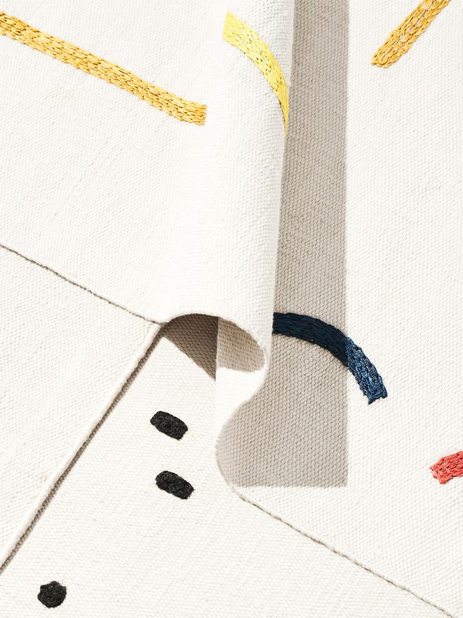 A close up image of several rugs from the Typewriter rug collection by Tomi Leppänen.