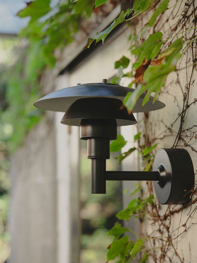 A detail of PH 3-2½ wall lamp outdoors