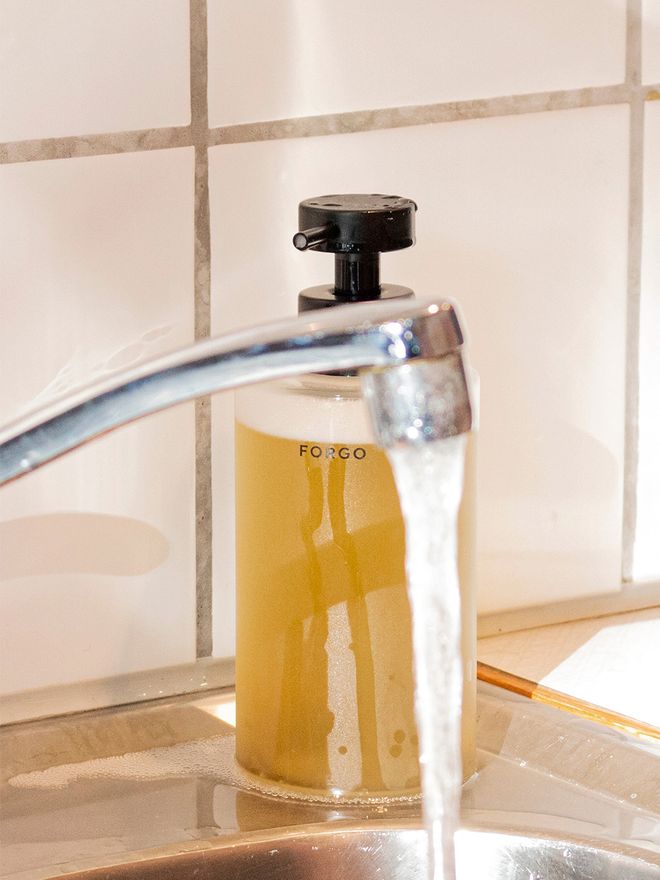 An image of Forgo's hand soap bottle in a kitchen.
