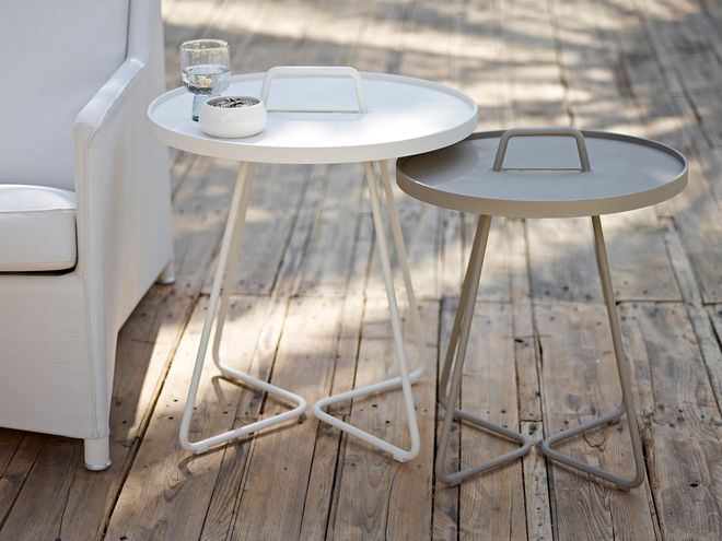 Cane-line's On-the-move tables on a terrace.