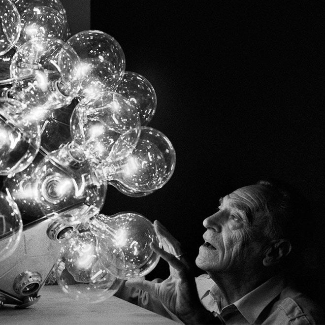 Designer Achille Castiglioni and his Taraxacum 88 lamp.