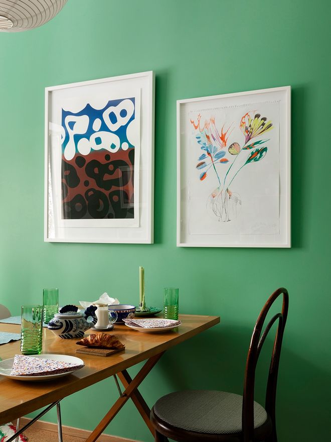 Vintage dining table and a green wall