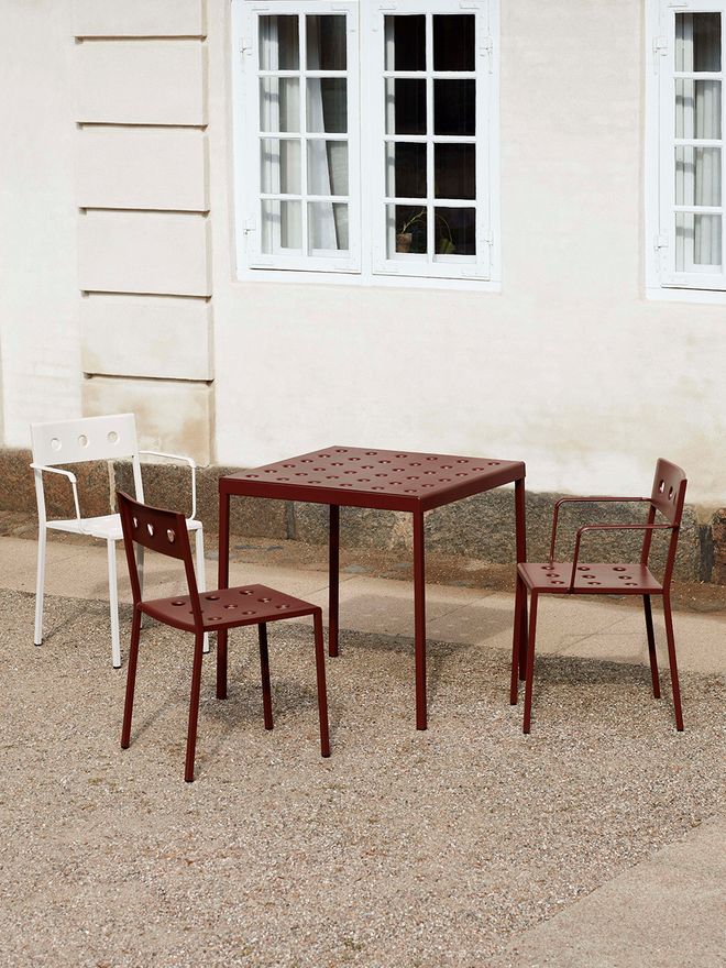 An image of HAY's Balcony chairs and tables outdoors.