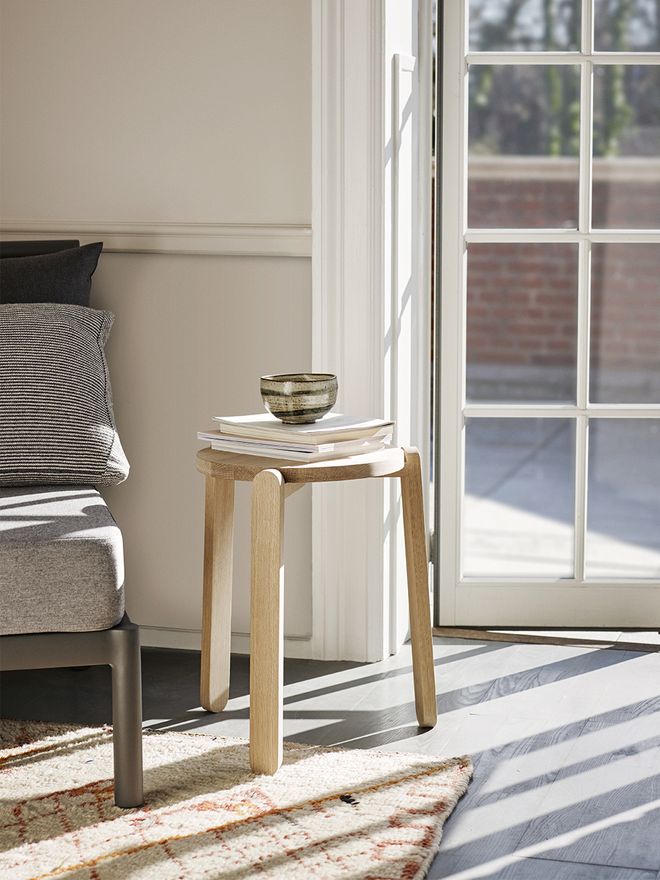Skagerak's Nomad stool in living room decor.