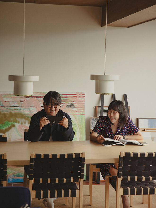 Egg 2 and Dora in their dining room with Artek designs