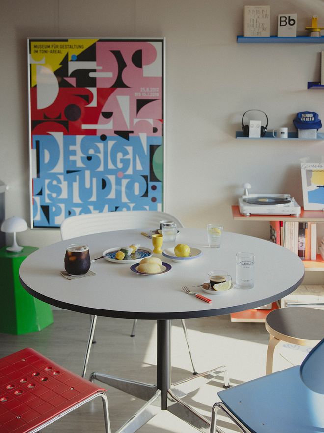 A collection of different chairs by a dining table