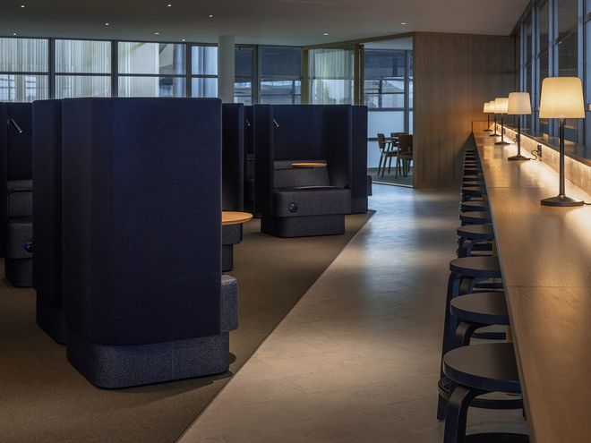 Wooden Artek chairs at Finnair Lounge