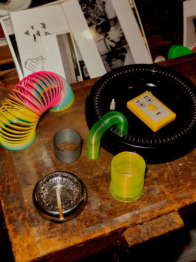 A detail of working desk with various toys