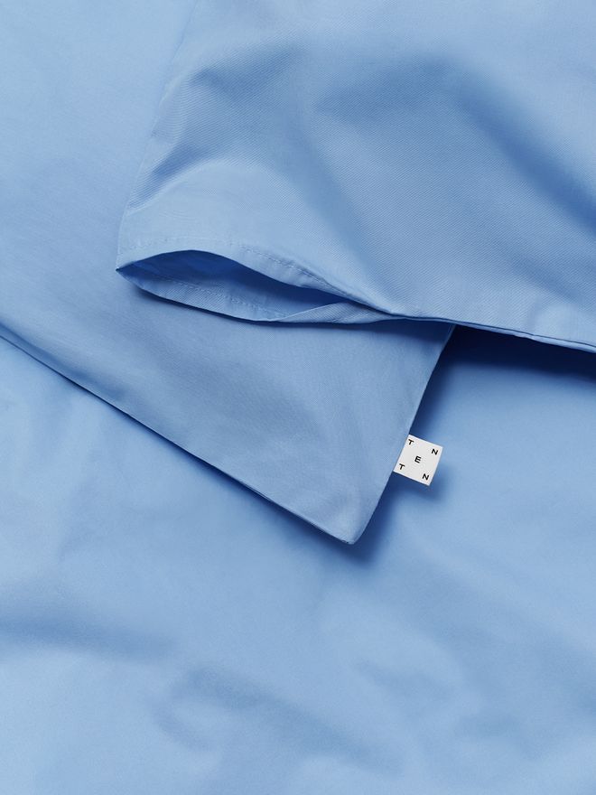 A detail of cool blue Unten bedding by Tenten
