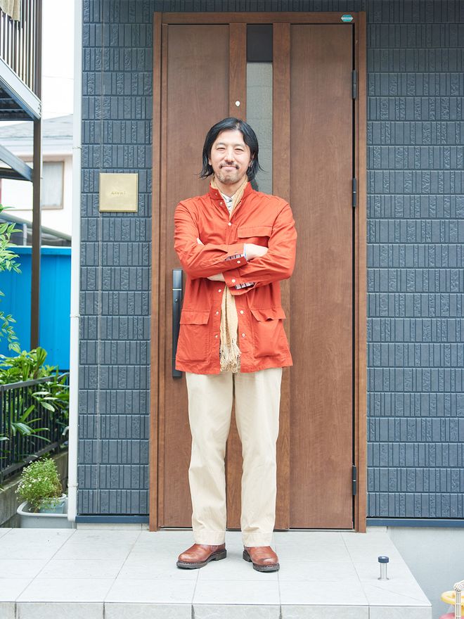 Takeshi Asami outside his home.