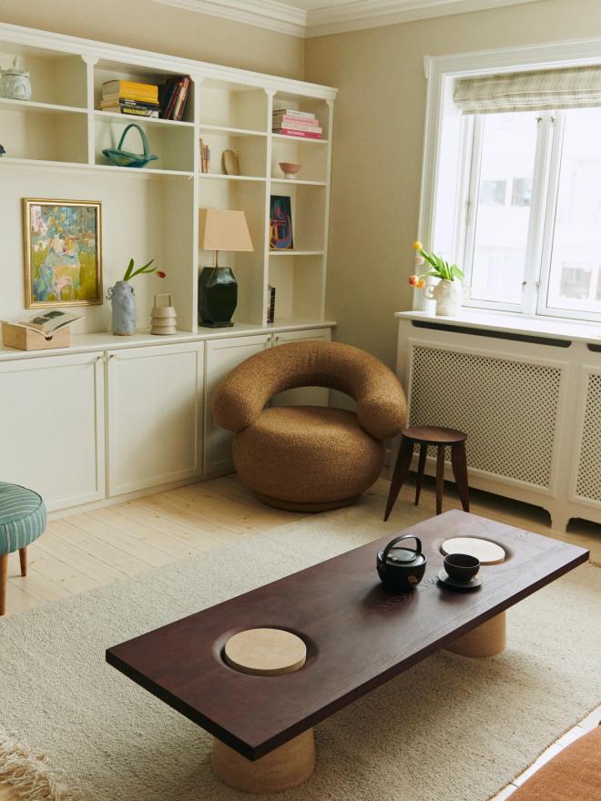 Ferm Living's Orbo lounge chair in the corner of a living room