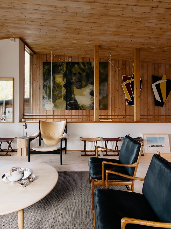 A lounge area with various Danish design chairs