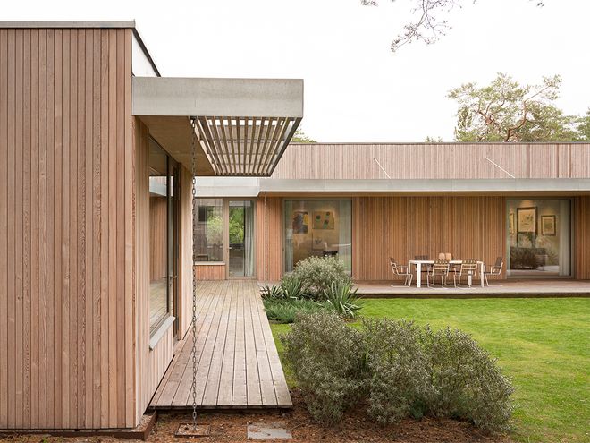 An image of Villa MSV, a private home located in Sweden. The image features the façade and the terrace of Villa MSV.