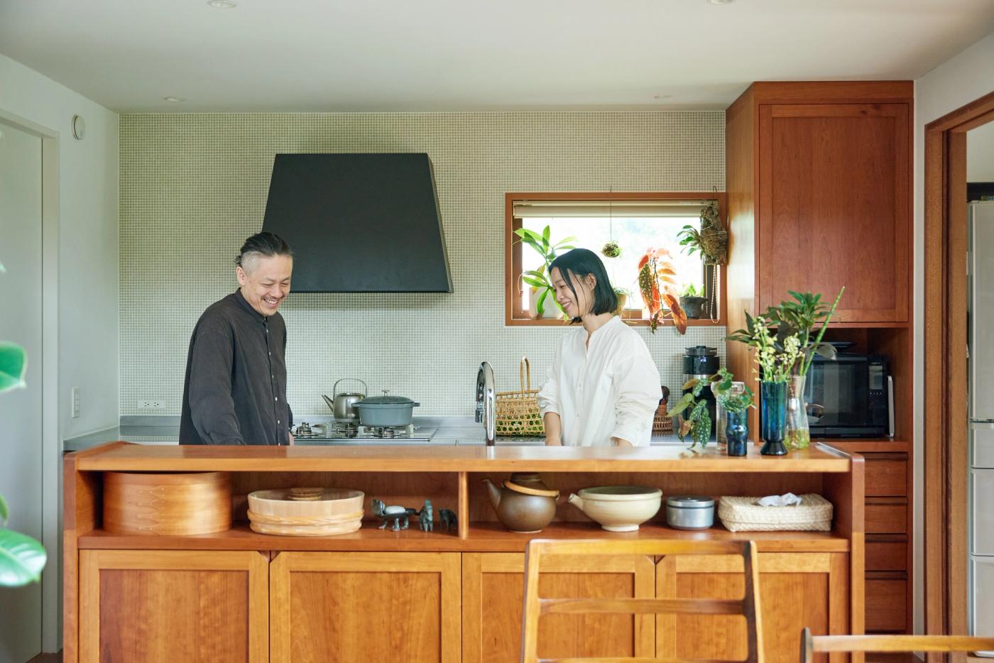 A couple standing in the kitchen 