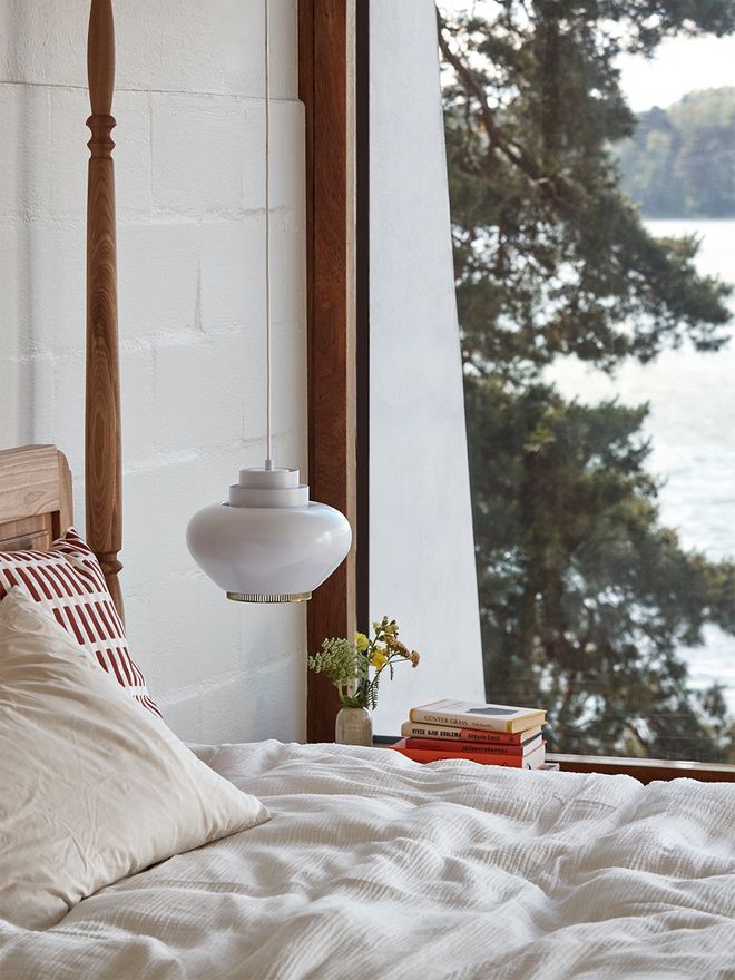 An image featuring Artek's A333 pendant as part of the bedroom decor.