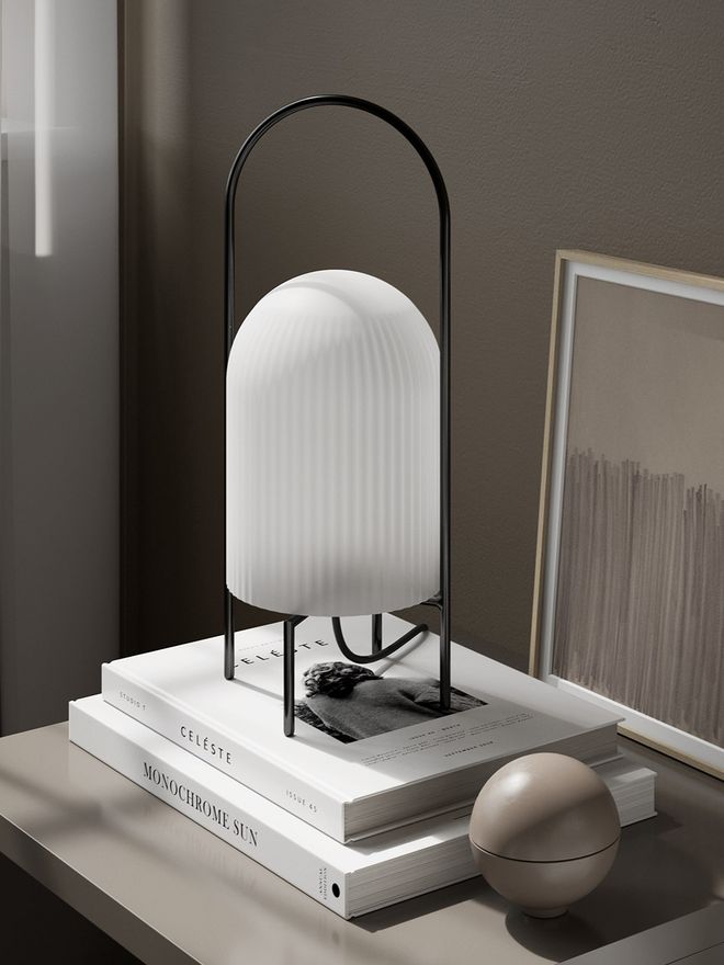 Woud's Ghost table lamp on a sidetable.