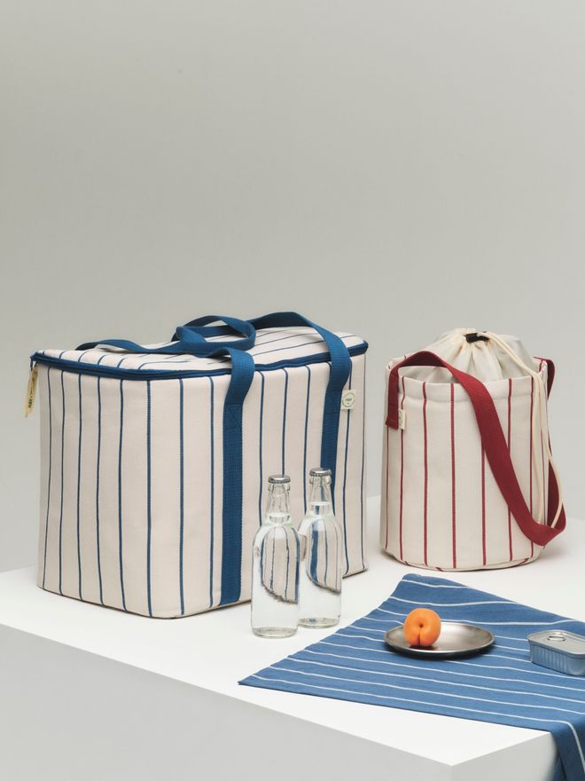 Close-up of the Outdoor Market cooler bag, bottle bag, and kitchen towel