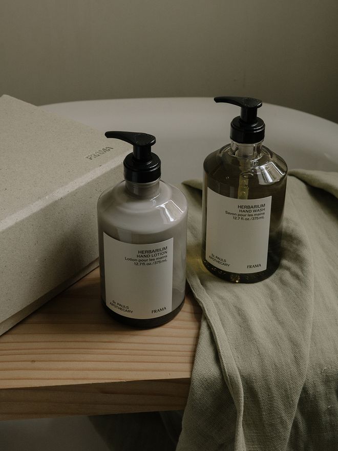An image with Frama's Herbarium hand soap and hand lotion as part of the bathroom decor.