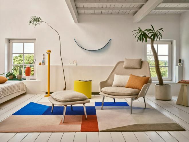 Vitra’s Slow chair and ottoman on a colorful rug