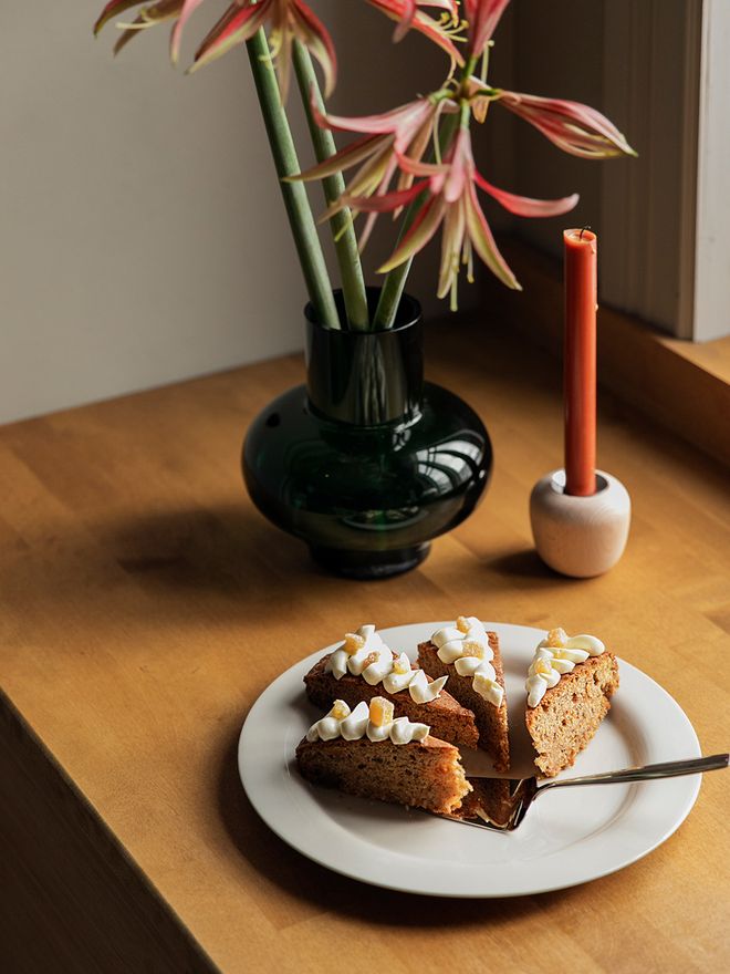 Four slices of a carrot cake on a plate
