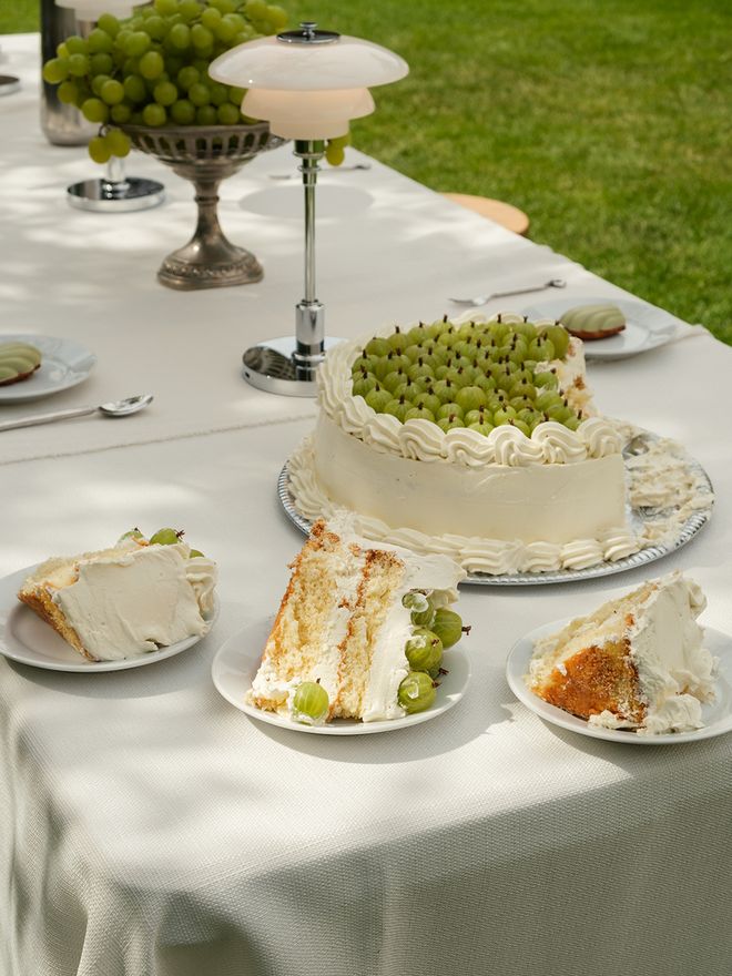 A detail image of a cake and a Louis Poulsen lamp
