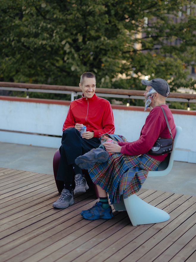 Two persons sitting on a terrace