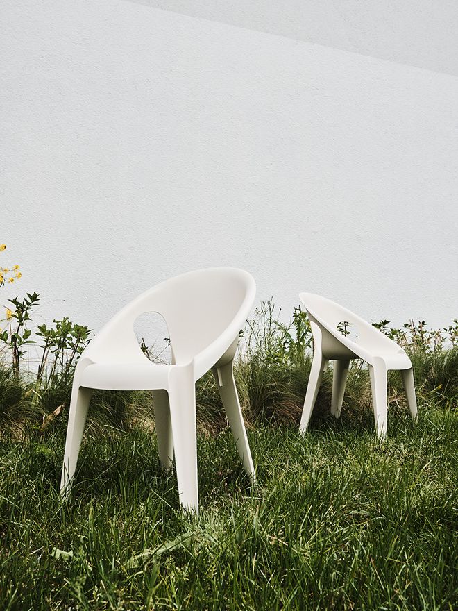 Two white Bell chairs